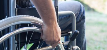 Paralyzed man using his wheelchair